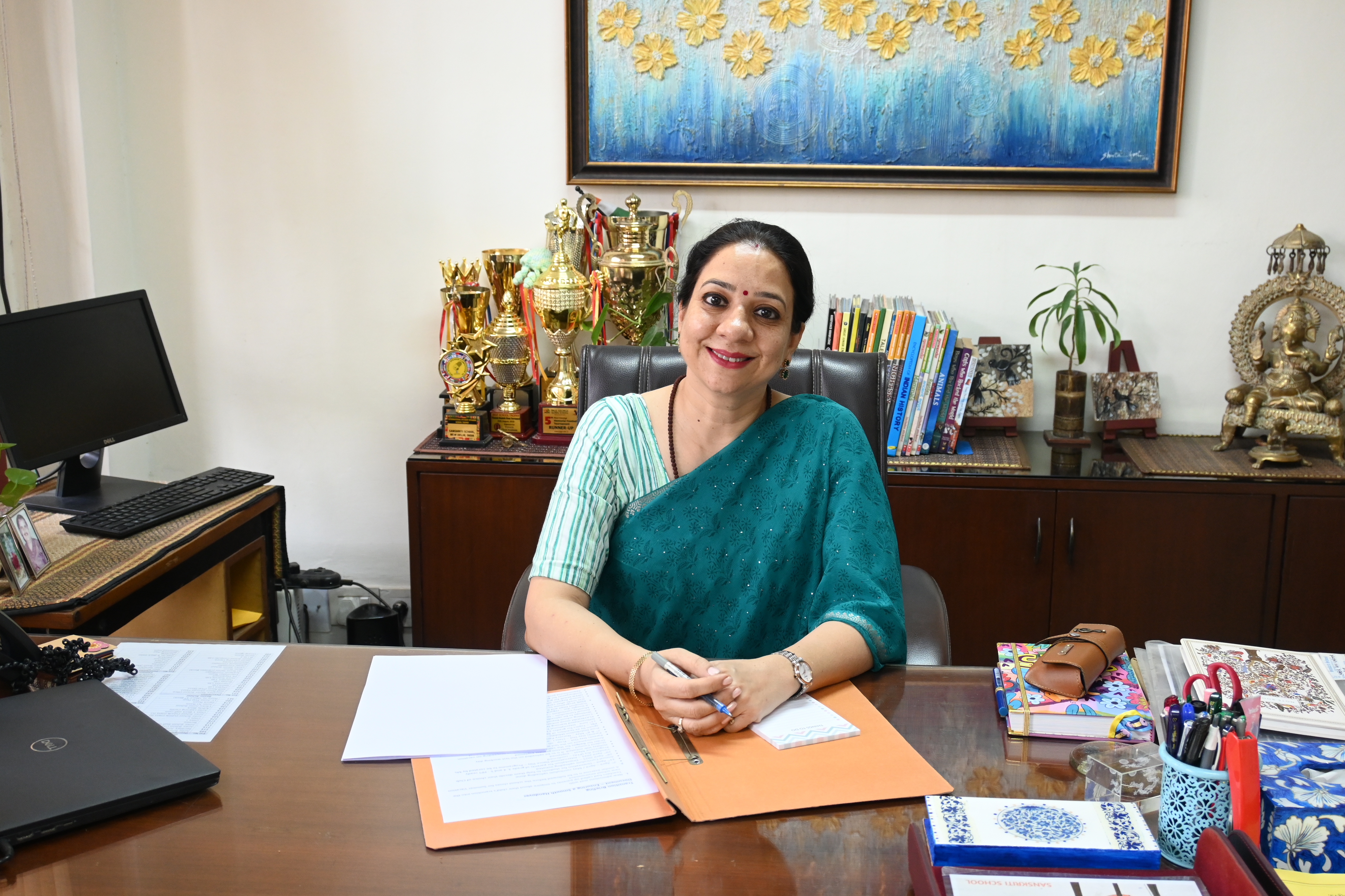 Photo of Mrs. Ekta Singh, the junior school incharge, sitting in her office.